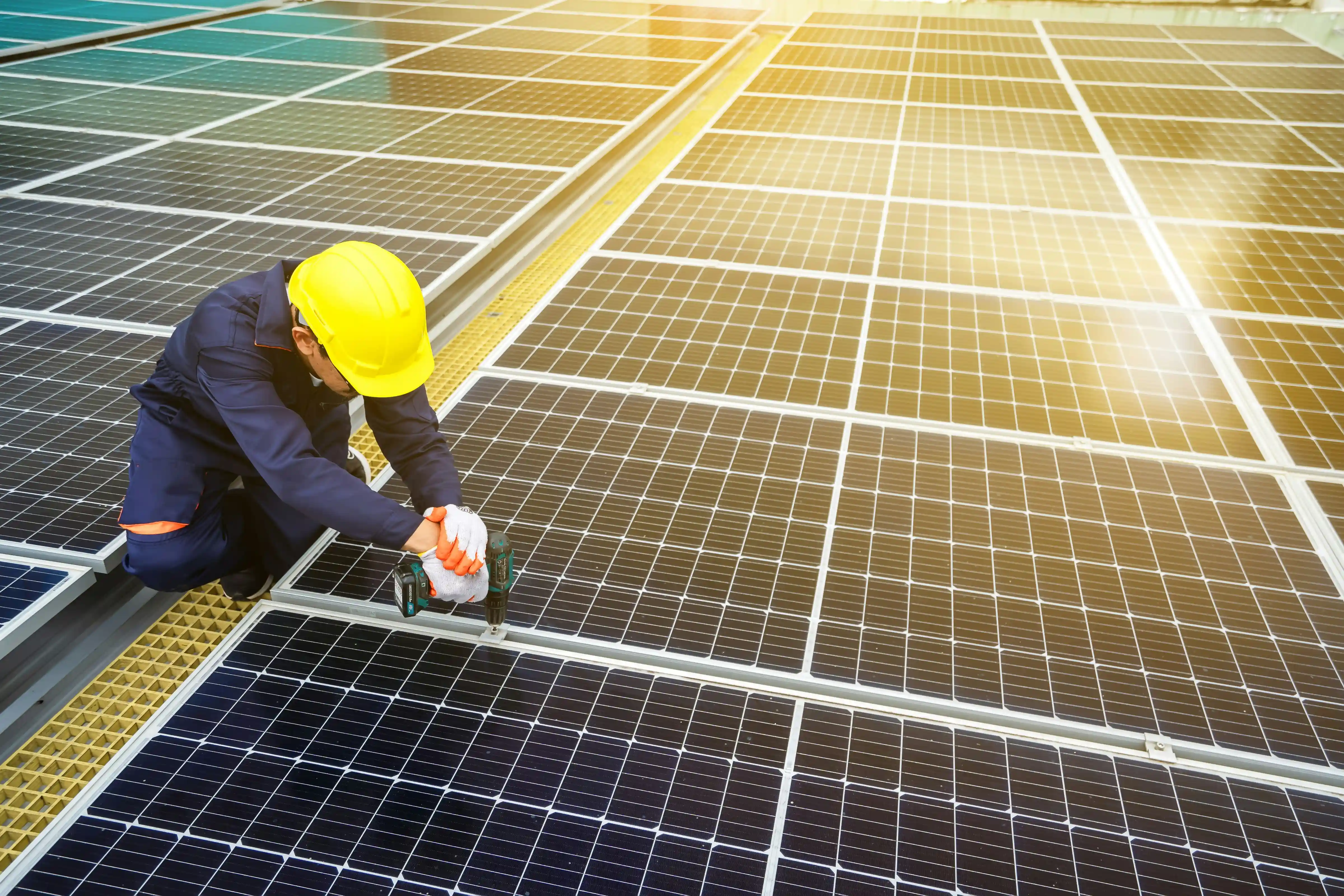 https://unsplash.com/photos/a-man-in-a-hardhat-working-on-a-solar-panel-JlhvFEVMwng